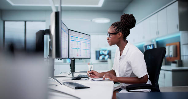 Healthcare professional using digital technology at workstation